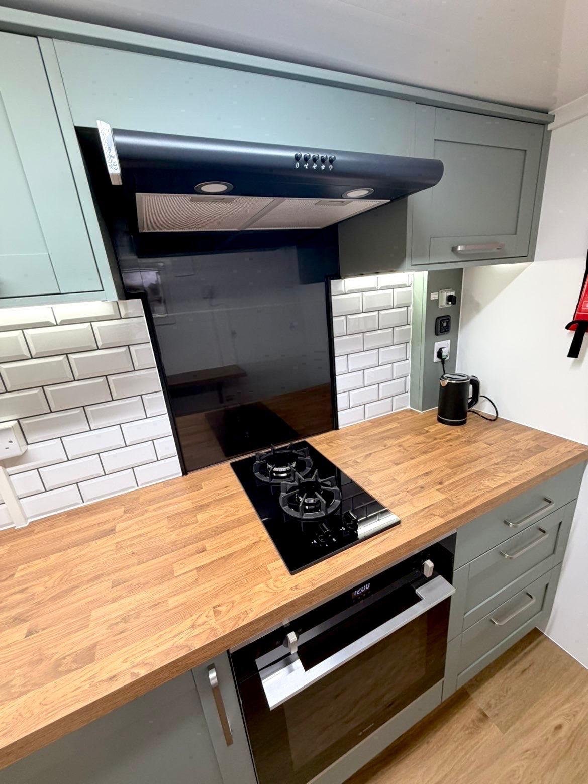Gas hob and oven setup with extractor fan